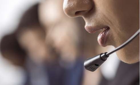 Telephone headset on person close-up